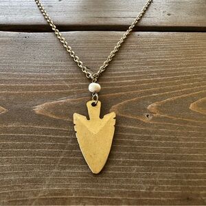 Long gold arrow and pearl necklace